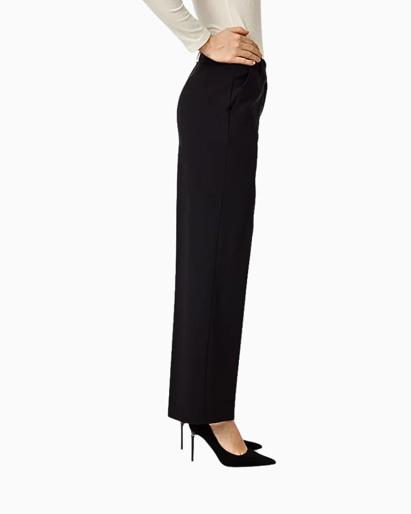 Side view of black Britt trousers styled with heels