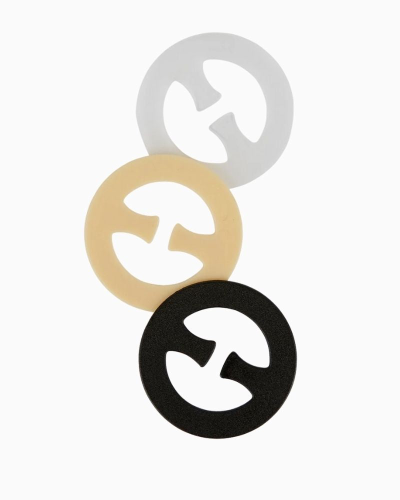 Close-up view Secret Weapons Bra Clips in round shape – clear, black, and nude