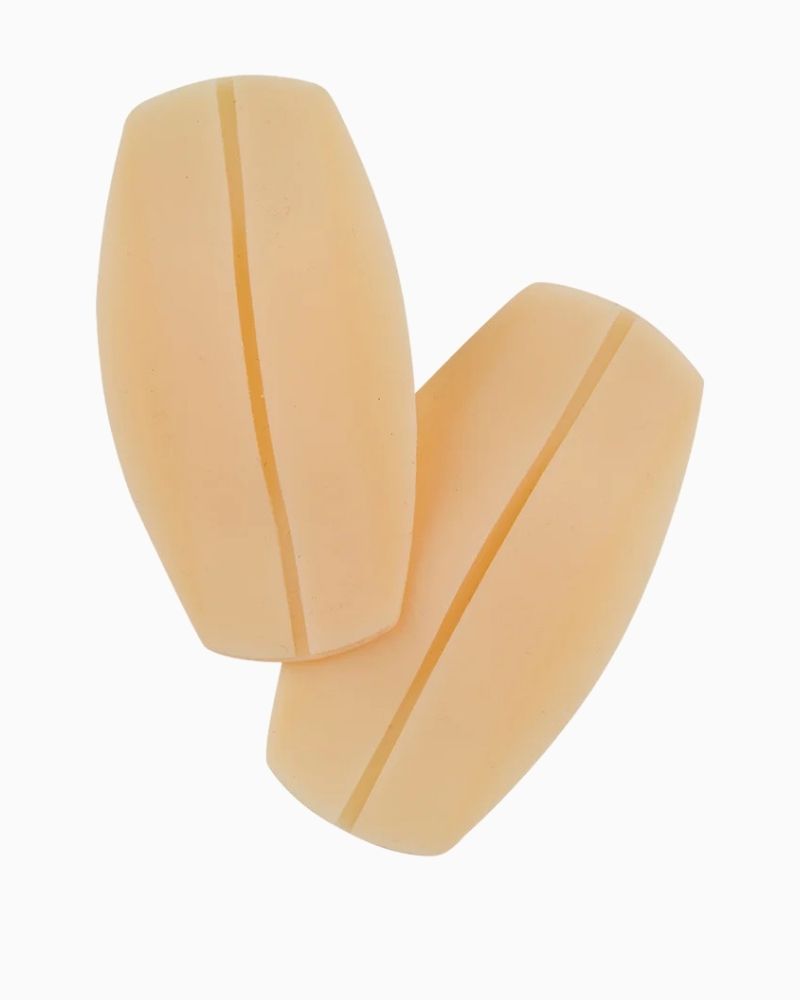 Close-up of Secret Weapons silicone bra strap pads showing soft flexible design