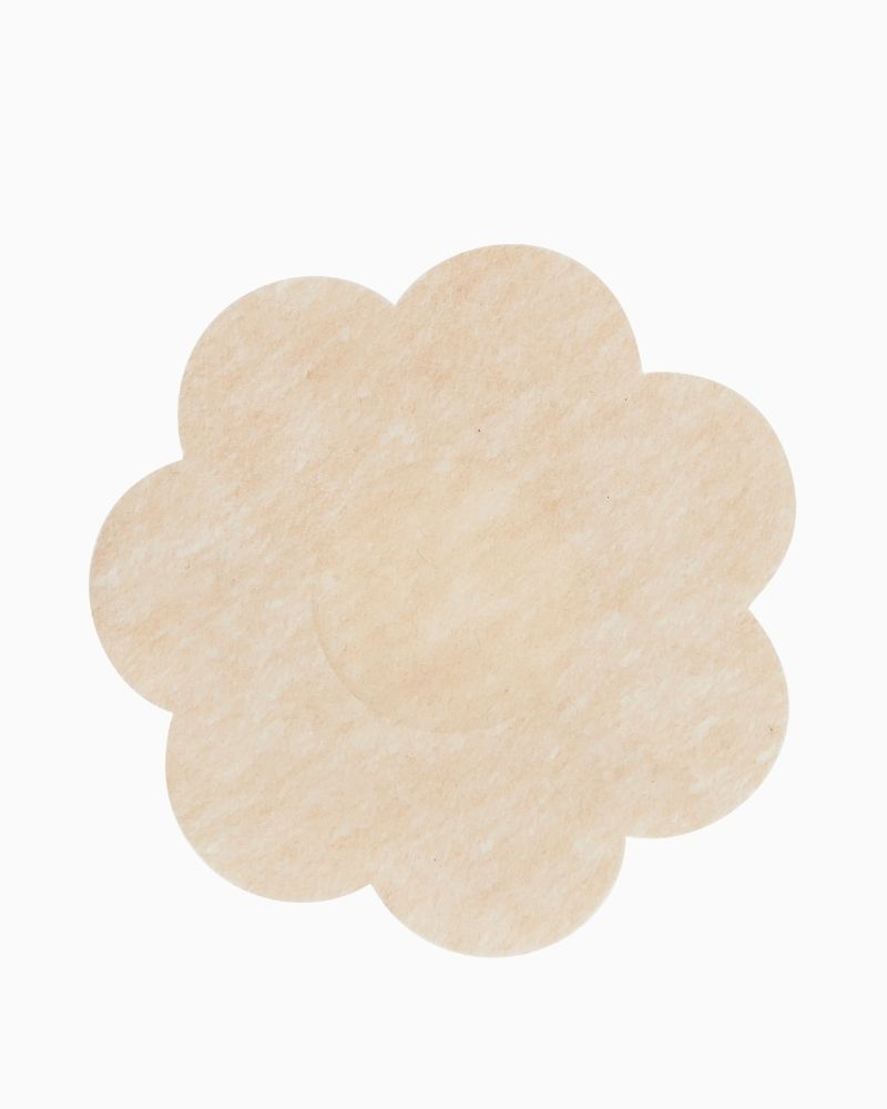 Close-up of lightweight satin stick-on nipple covers for discreet wear