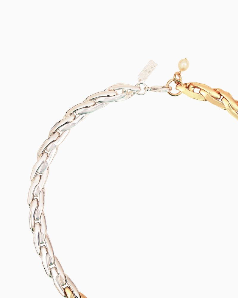 Close-up of chunky link collar necklace with freshwater pearl detail