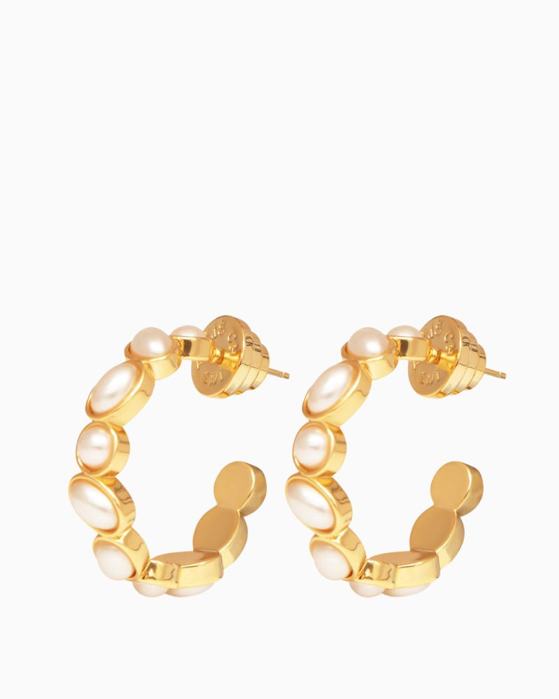 Pair of lightweight pearl hoop earrings shown with linen drawstring pouch