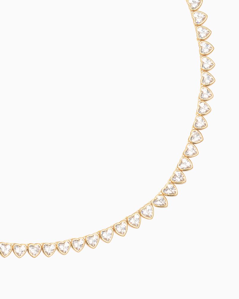Close-up of heart-shaped cubic zirconia tennis necklace with freshwater pearl detail