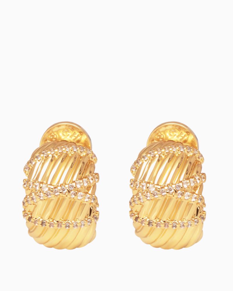 Close-up of small gold statement hoop earrings featuring cubic zirconia sparkle