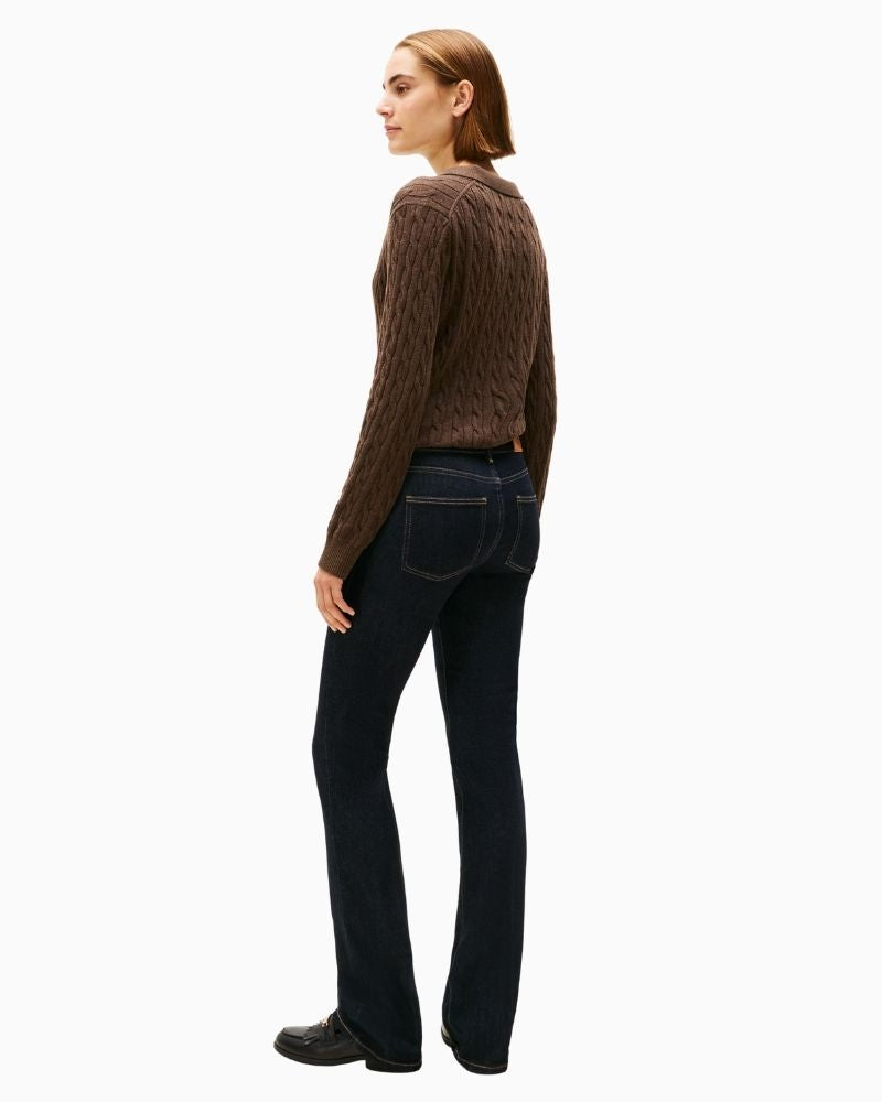 Back view of mid-rise bootcut jeans showing pocket embroidery and clean finish