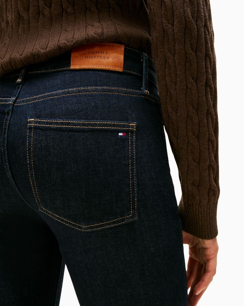 Close up of Tommy Hilfiger bootcut jeans in stretch denim with pressed crease and mid-rise waist