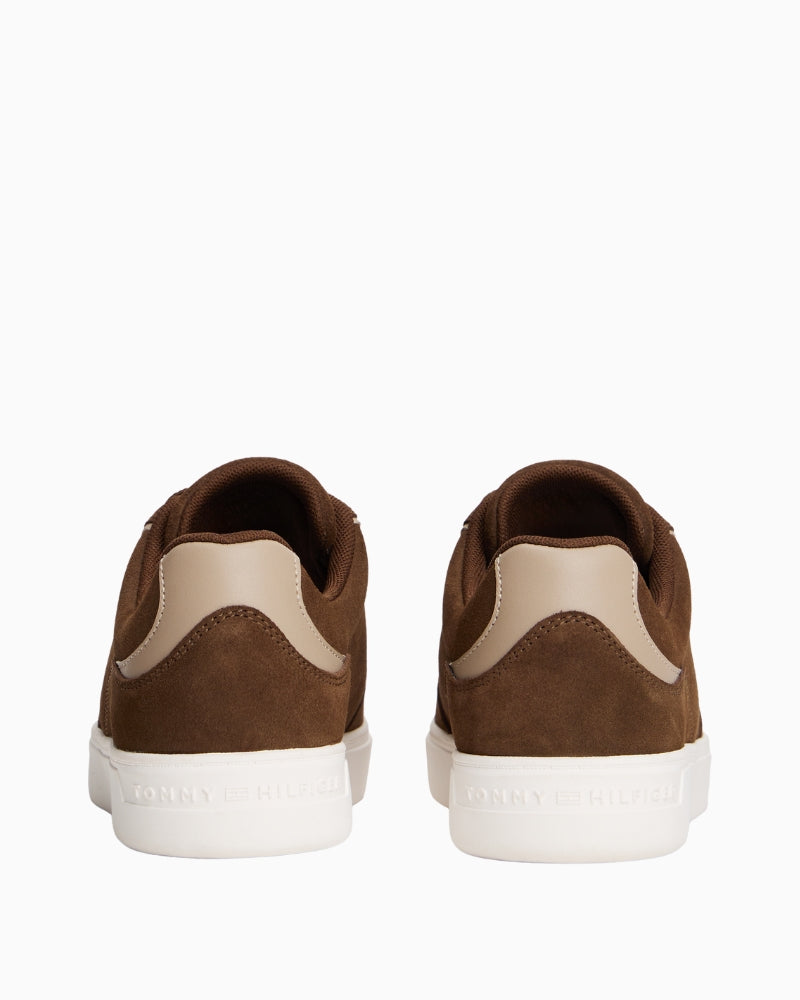 Close-up of suede texture and stitching on Tommy Hilfiger brown casual sneaker