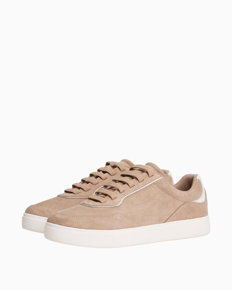Side view of Tommy suede sneakers showing soft finish and lace-up design