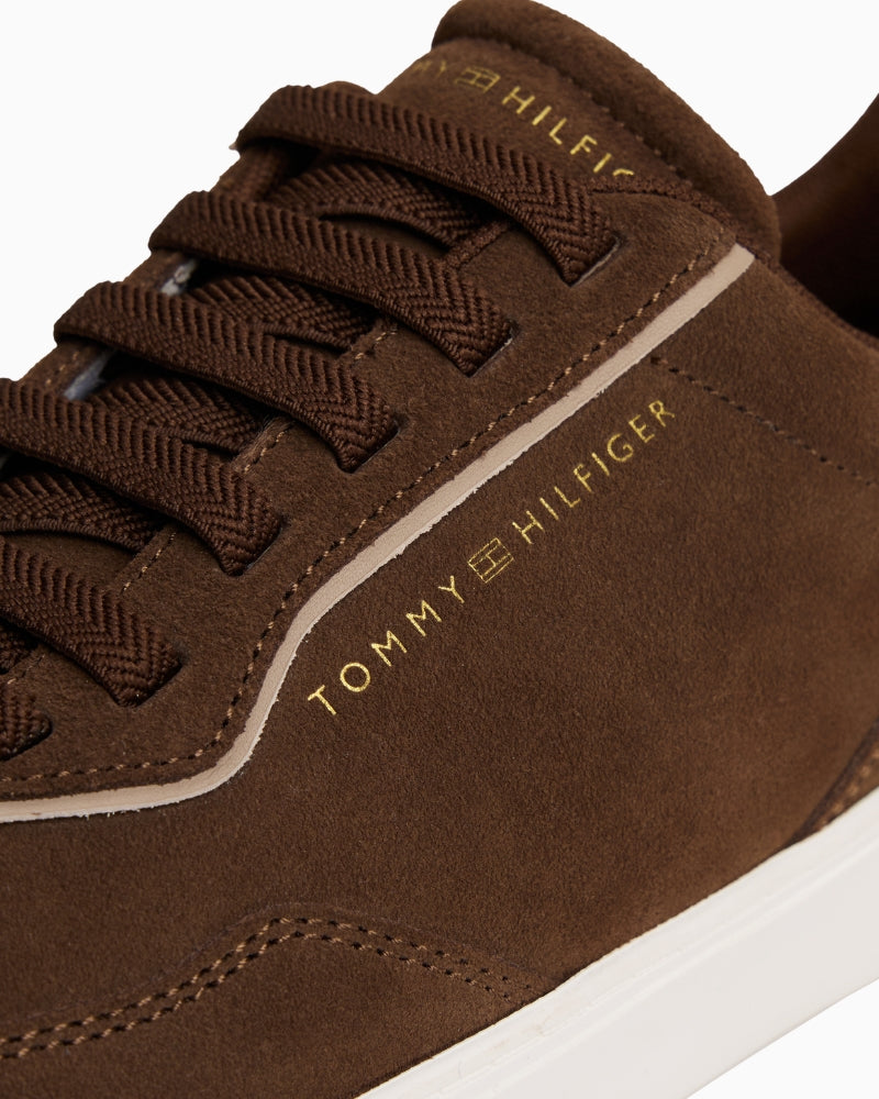 Close-up of suede texture and stitching on Tommy Hilfiger brown casual sneaker