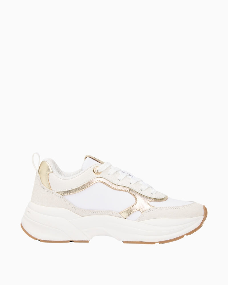 Side view of white and gold chunky trainers by Tommy Hilfiger