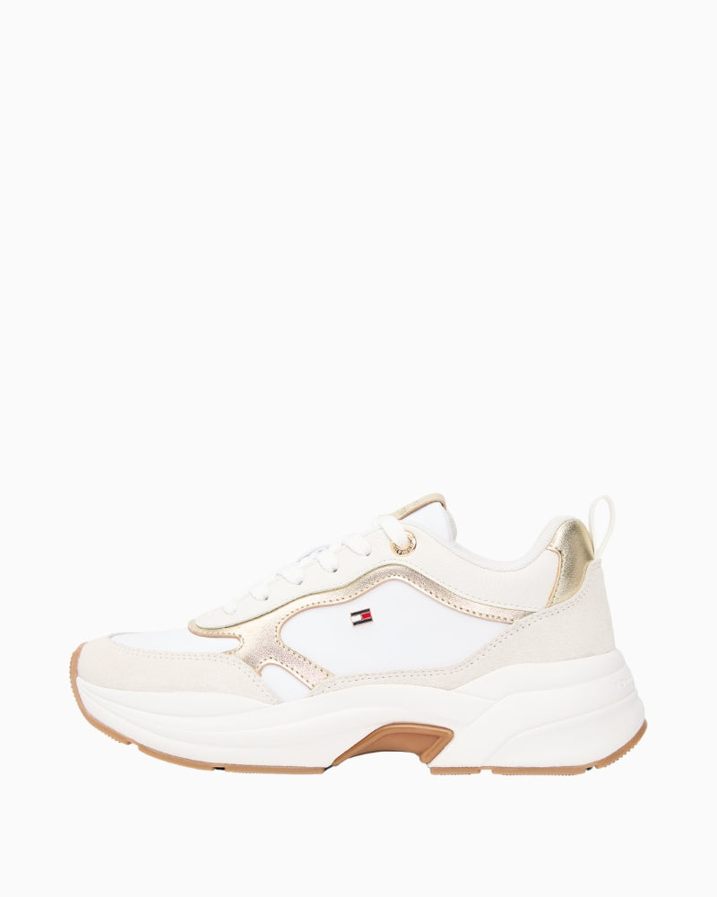 Side view of white and gold chunky trainers by Tommy Hilfiger
