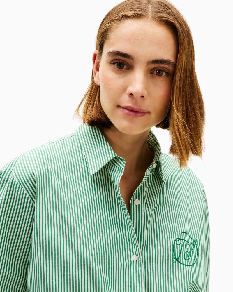 Close-up of collar and branded button placket