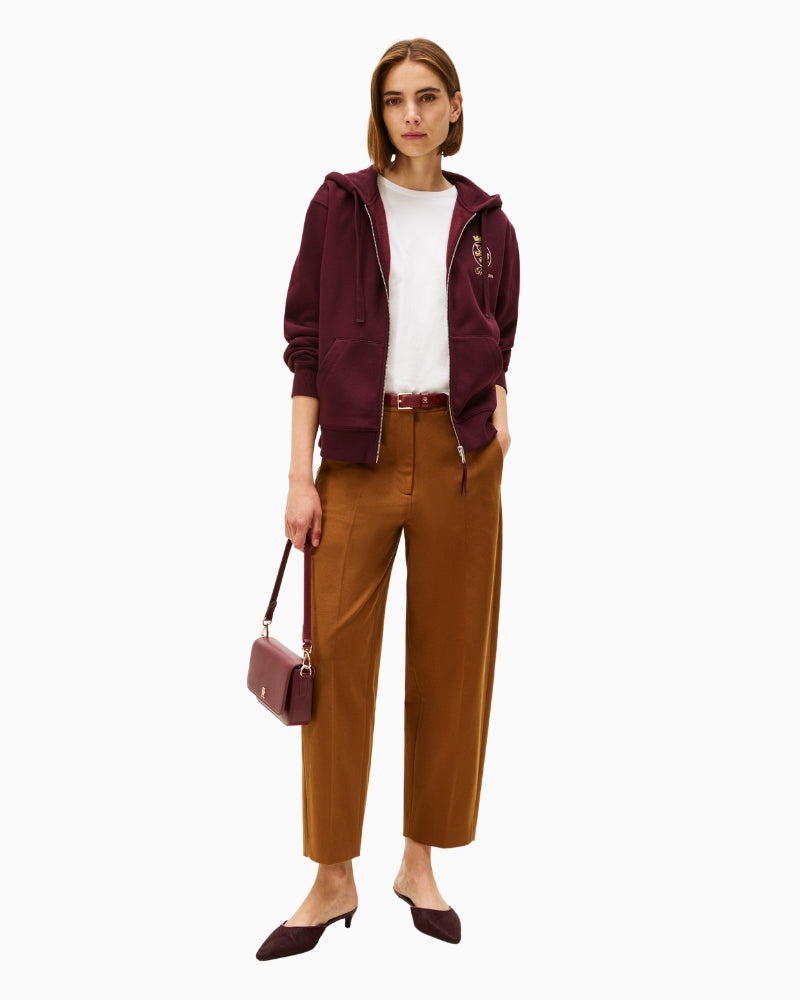 Front view of burgundy zip jacket with ribbed cuffs and hem