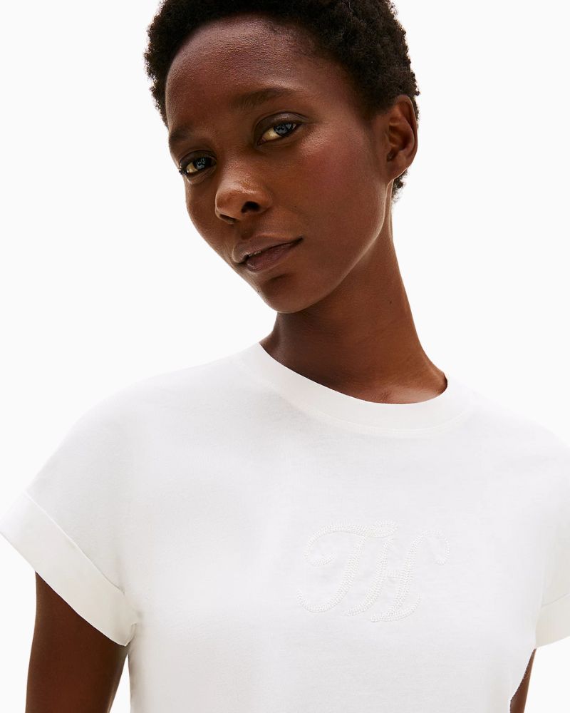 Close-up of Tommy Hilfiger crew neck tee with turn-back sleeves