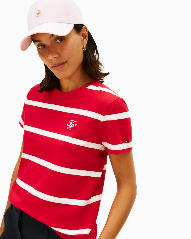 Close-up of embroidered script logo on soft cotton jersey fabric