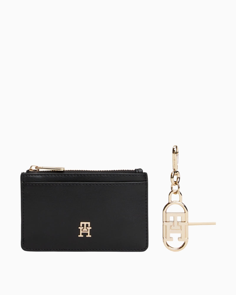 Black long card holder with attached charm bag in faux leather