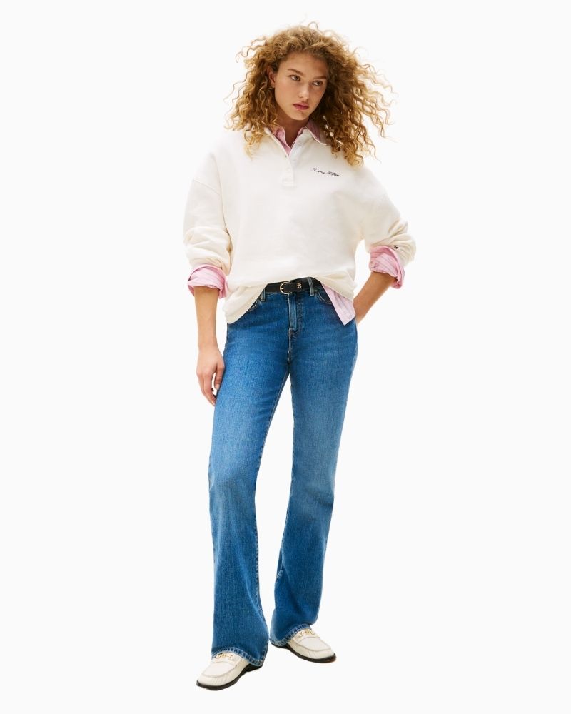 Front view of five-pocket bootcut jeans with button and zip closure