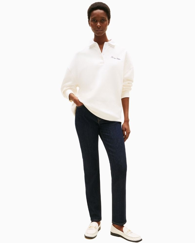 Classic five-pocket stretch denim styled with casual trainers