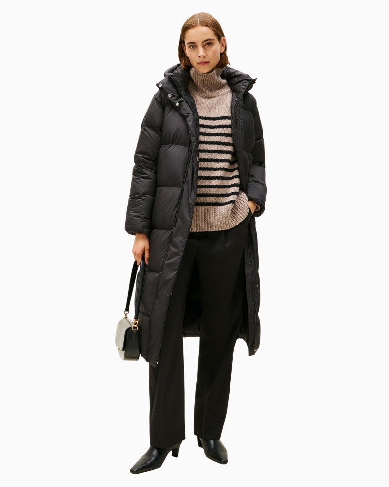 Women’s long black winter coat by Tommy Hilfiger with subtle branding