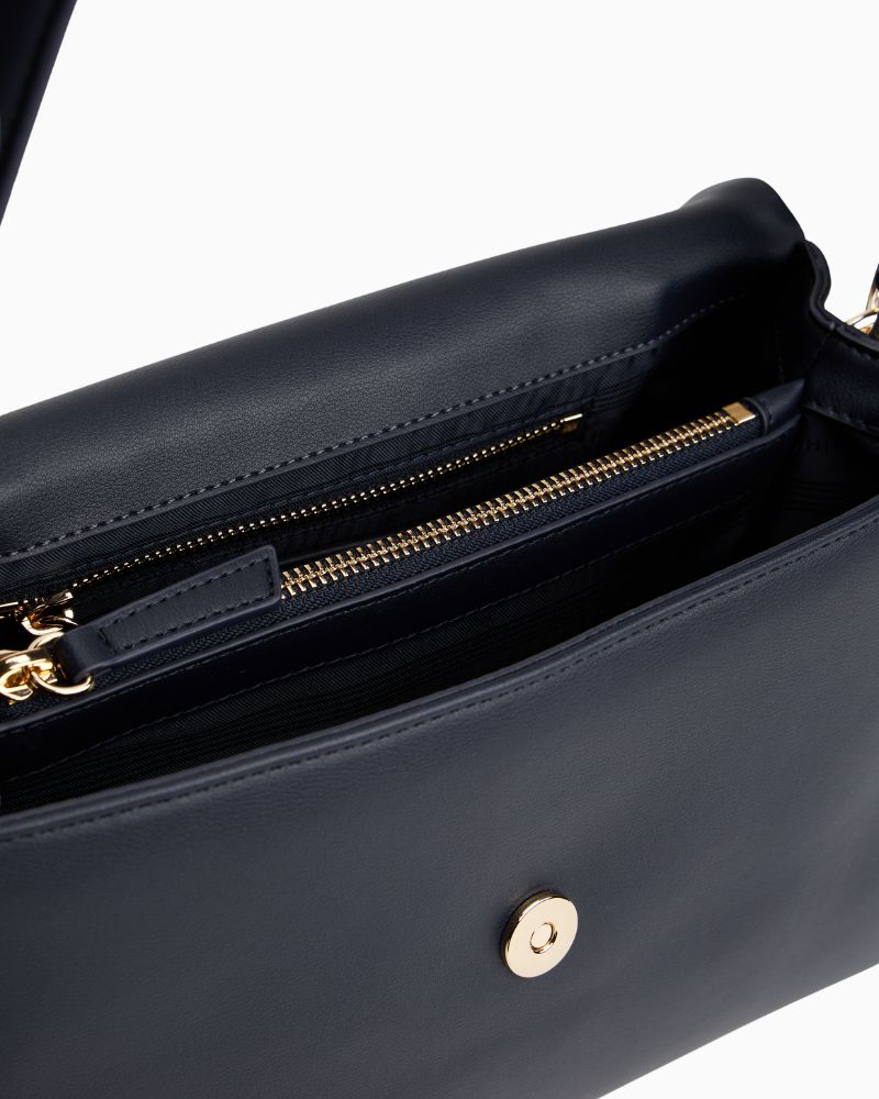 Interior of TH Modern Essential Bag showing compartments and zipped section