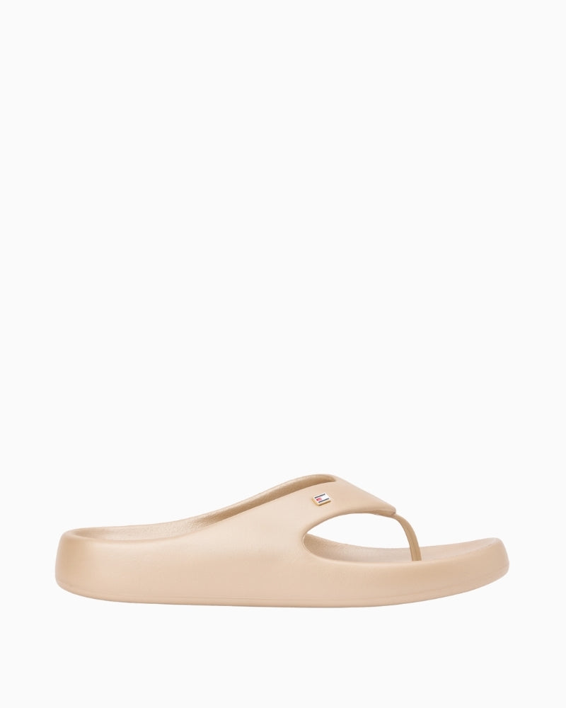 Cream Tommy Hilfiger pearlized summer sandal angled view on white background – Áines Boutique