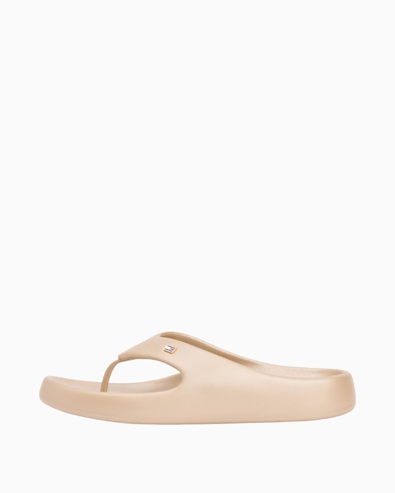 Cream Tommy Hilfiger flip-flop sandal side view showing pearlised finish – Áines Boutique