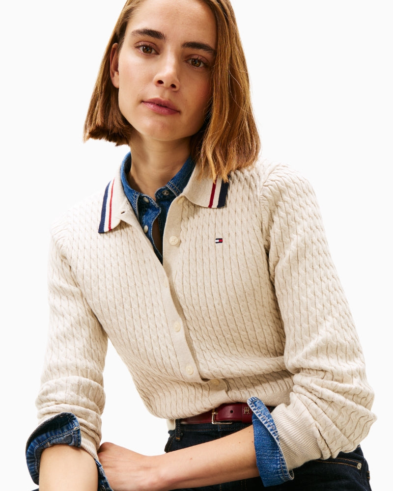 Close-up of polo-style collar and buttons on beige cardigan