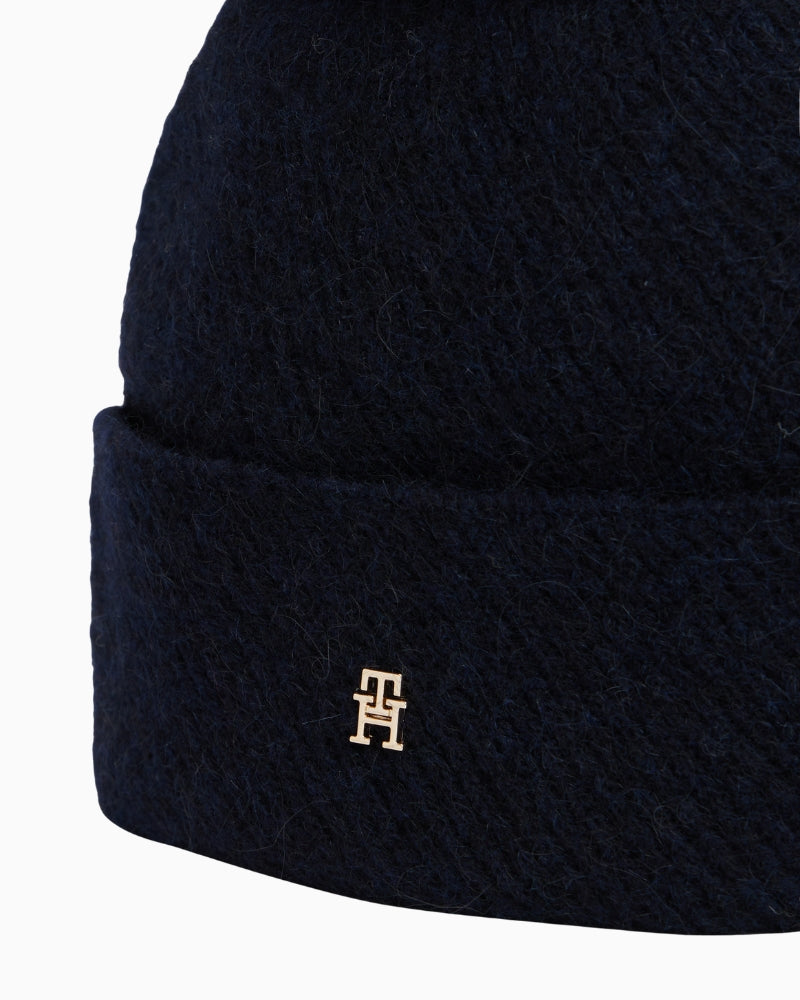 Close-up of faux-fur pom pom on wool-alpaca hat