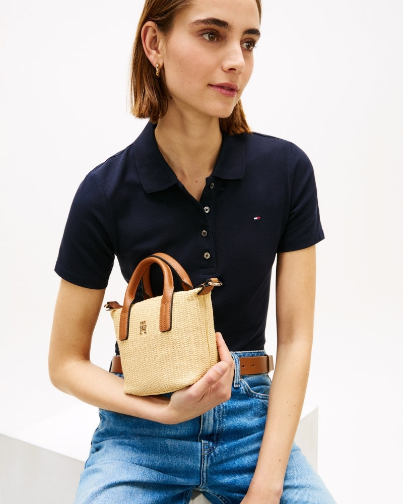 Woman wearing Tommy Hilfiger Popette micro tote raffia – Áines Boutique