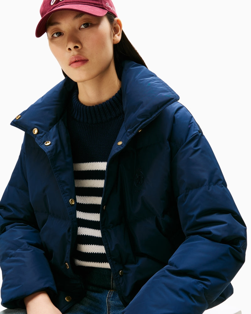 Close-up of quilt stitching and logo on Tommy Hilfiger jacket