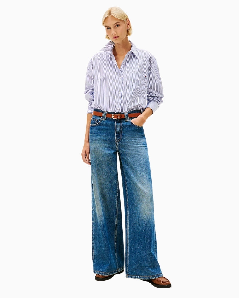 Chest pocket with embroidered Tommy Hilfiger flag on crisp white cotton shirt