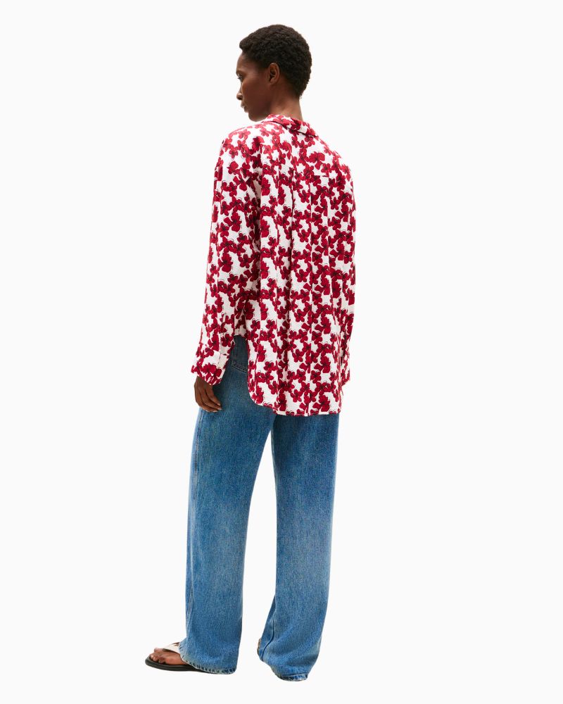 Back view showing dropped shoulders and breathable textured fabric