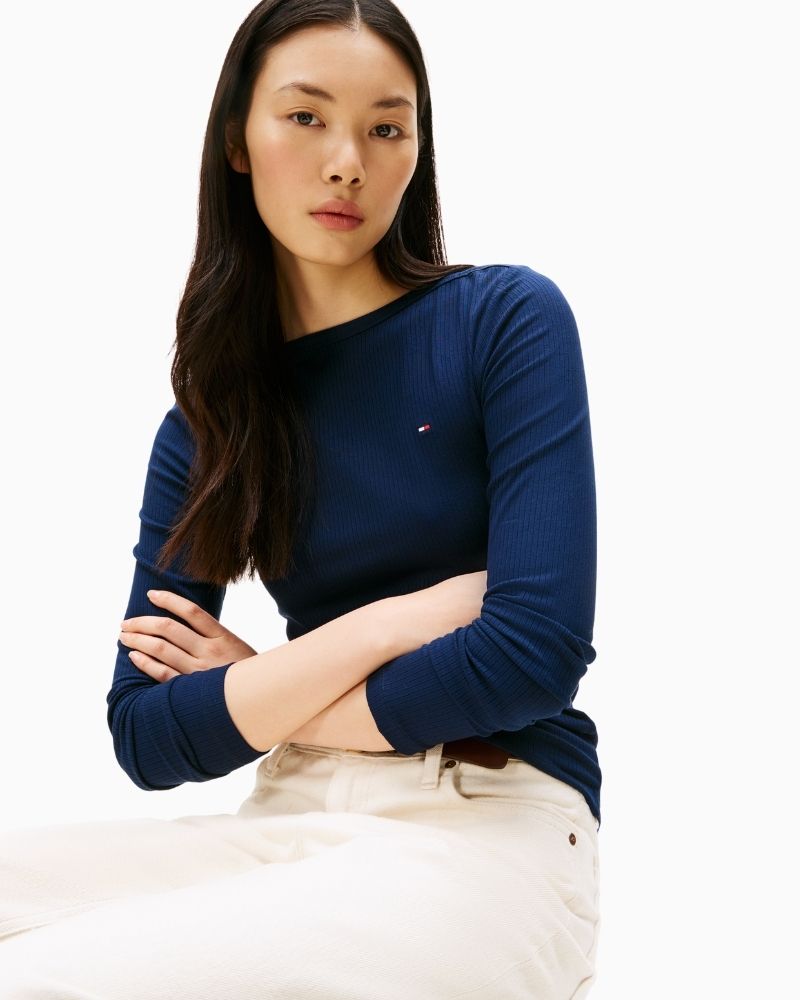 Close-up of chest logo embroidery on ribbed slim-fit top in stretch viscose