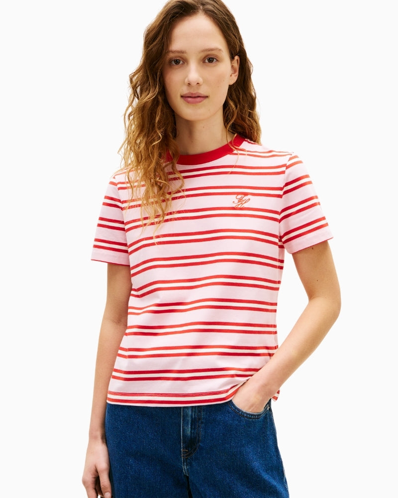 Woman wearing pink and red striped Tommy Hilfiger crew neck T-shirt front view – Áines Boutique