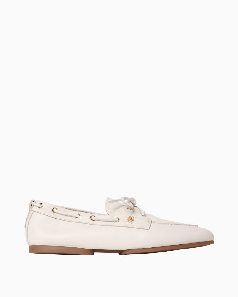 Cream Tommy Hilfiger sleek leather boat shoe front angled view on white background – Áines Boutique