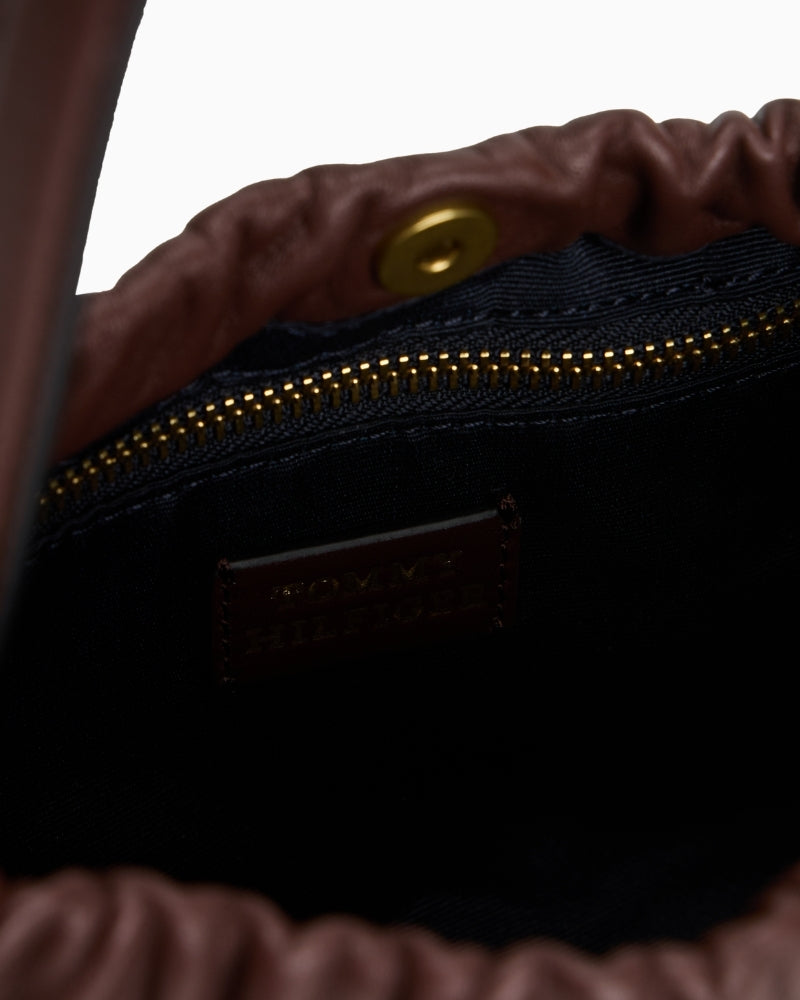 Compact crossover bag styled with casual everyday outfit