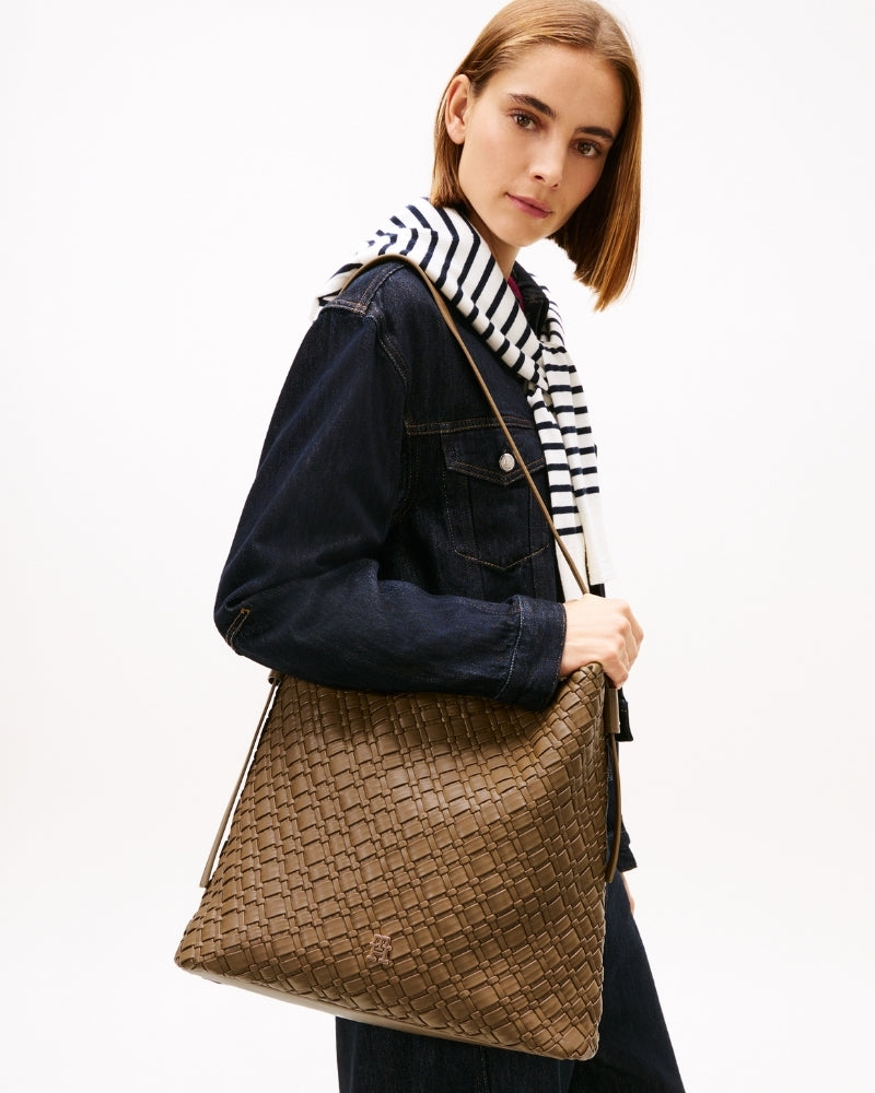 Tommy Hilfiger hobo bag styled with coat and boots for everyday wear