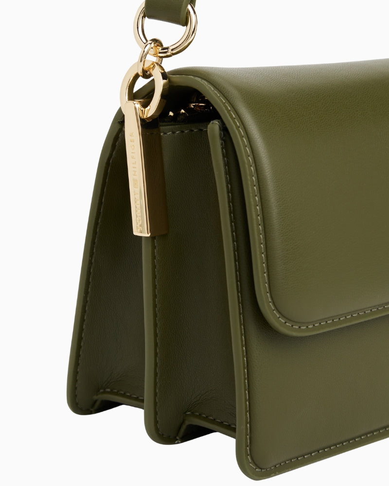 Side profile of black faux-leather TH Heritage bag with chain handle