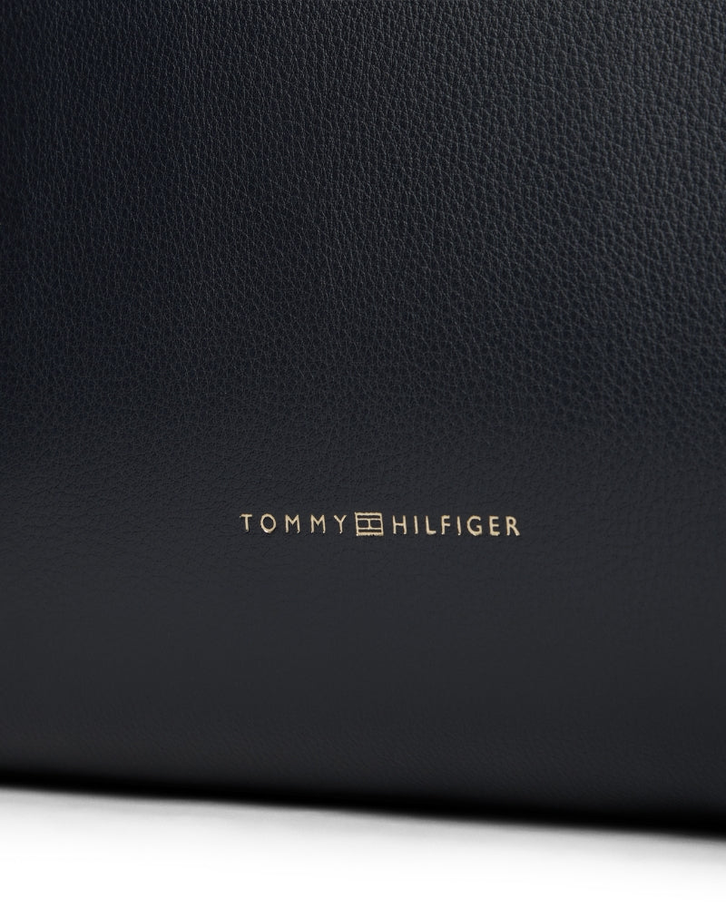 Closeup view of spacious faux leather tote with twin handles