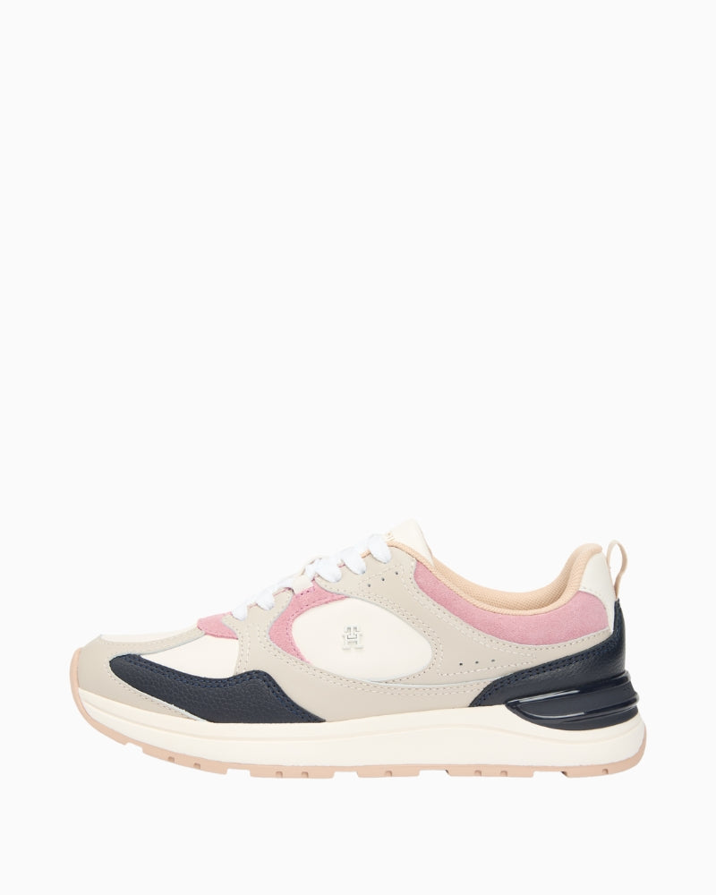 Side view of Tommy Hilfiger stone leather trainers with TH monogram