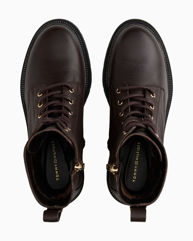 Front view of lace-up leather boots with rounded toe and durable sole