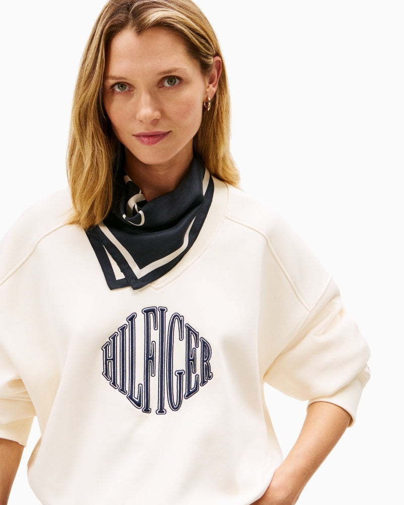 Close-up of embroidered Tommy Hilfiger logo on chest