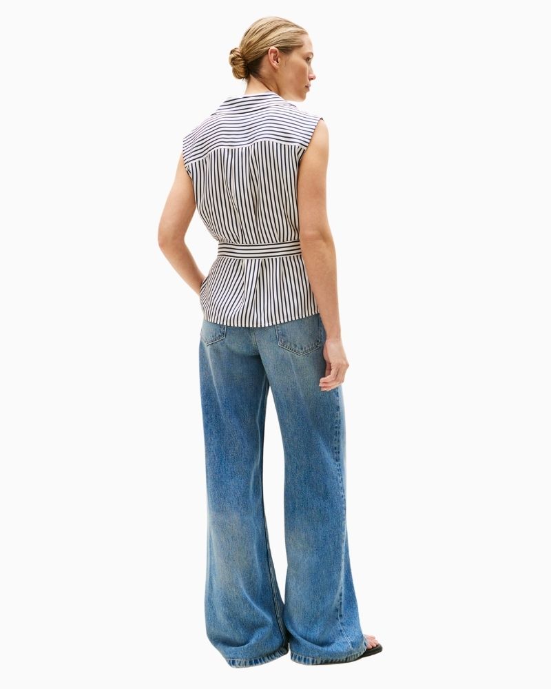 Back view of soft drape blouse with flattering v-neckline