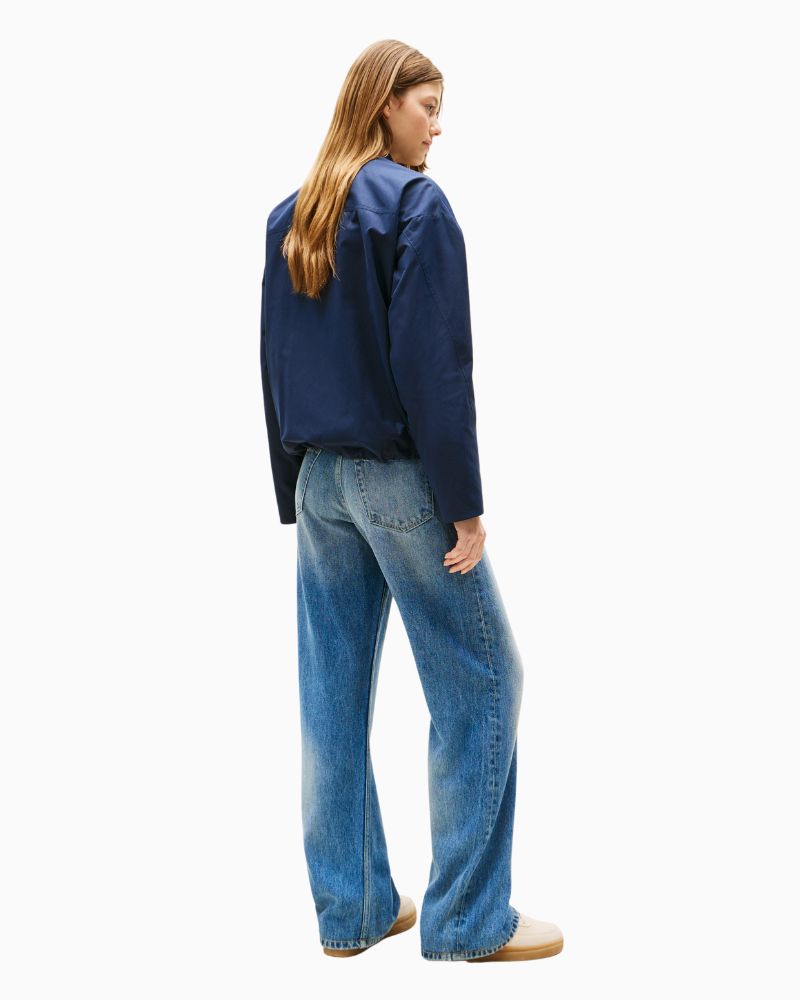 Back view of water-repellent jacket with dropped shoulders and soft ribbed hem