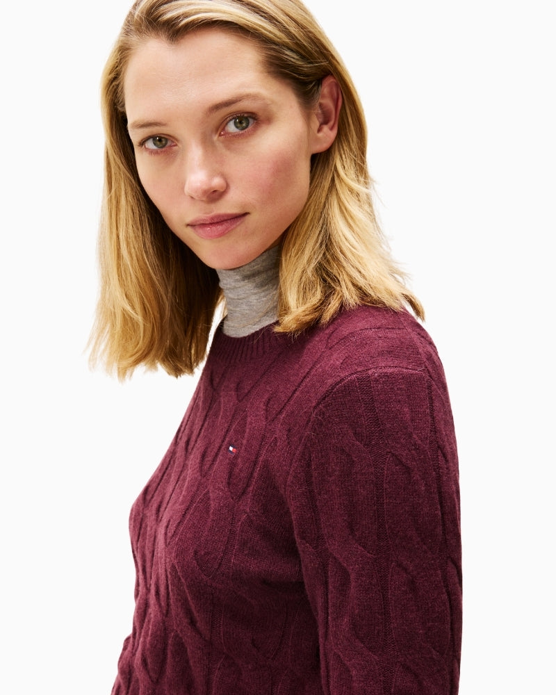 Close-up of cable texture and ribbed neckline on Tommy Hilfiger knit