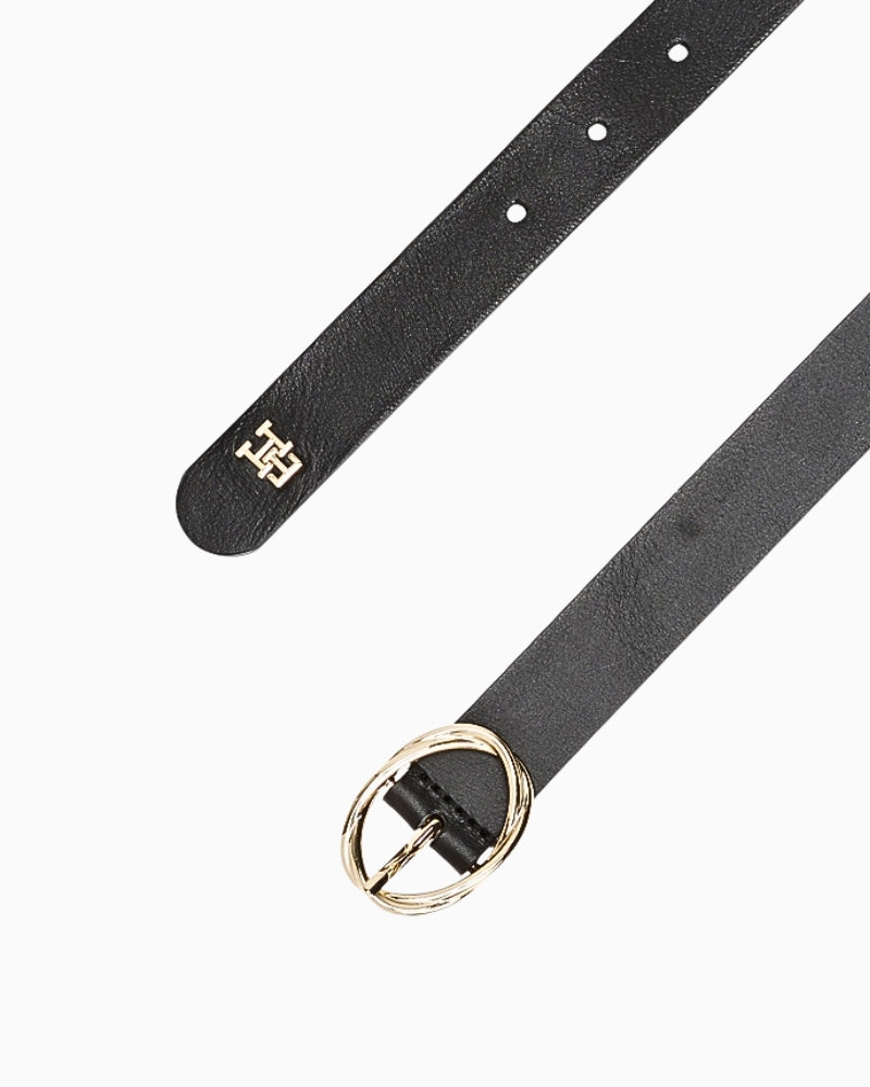 Close-up of Pennyblack black belt showing gold oval buckle and adjustable holes
