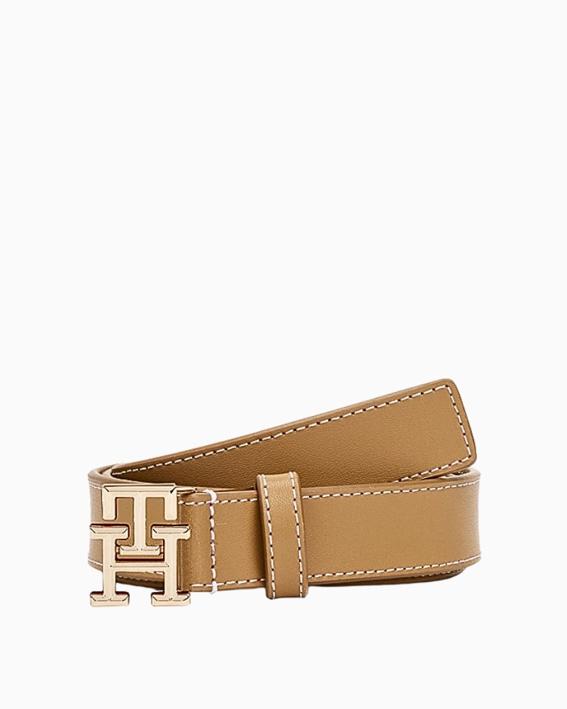 Tan leather women’s belt with gold Tommy Hilfiger monogram buckle and white stitching