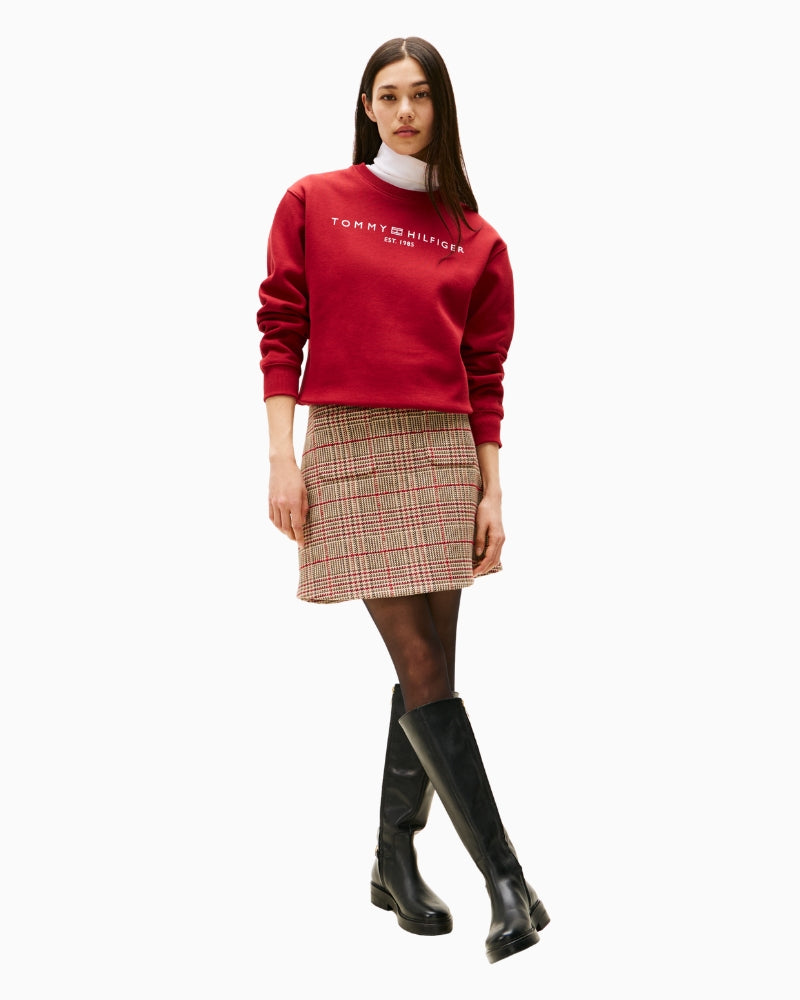 Model wearing red Tommy Hilfiger sweatshirt