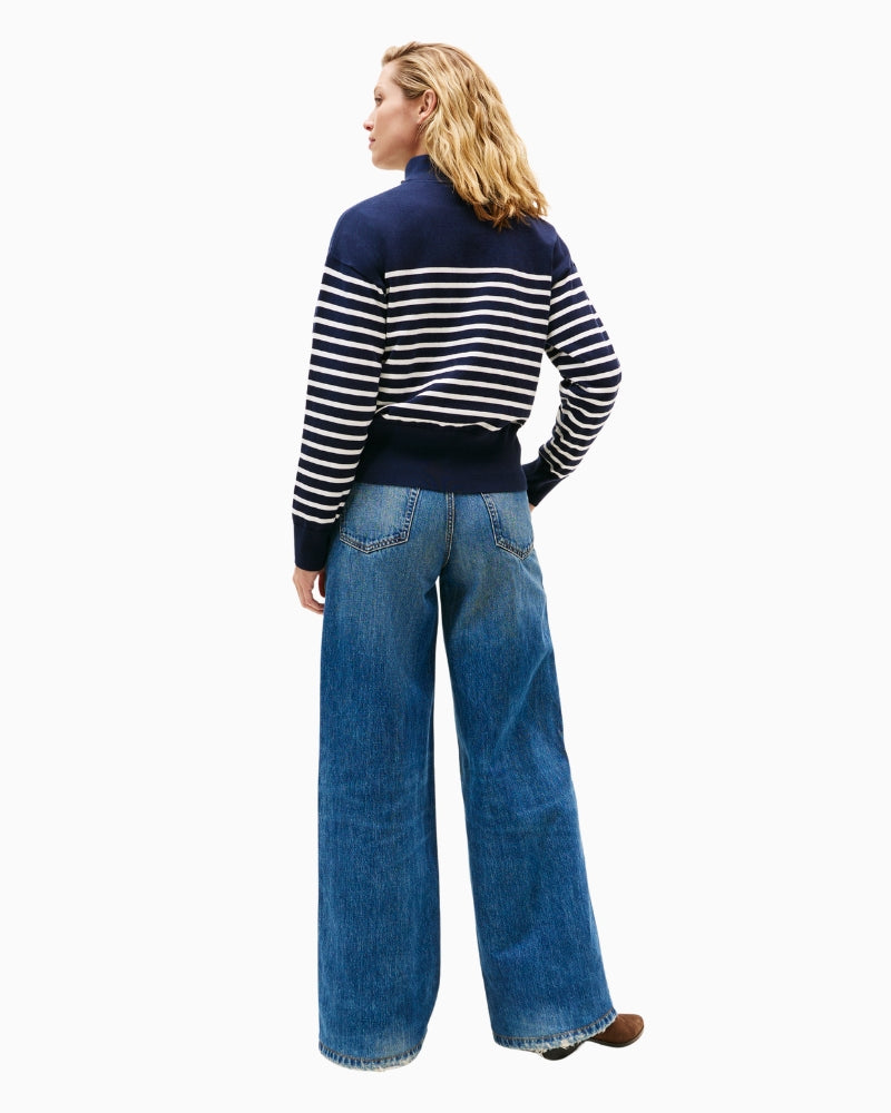 Rear image showing the full back design of the striped knit sweater with ribbed hem.