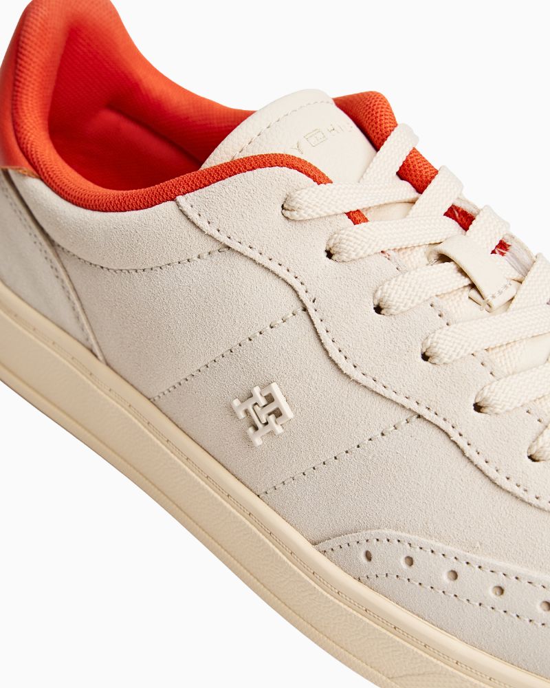 Close-up of off-white suede material and stitching detail